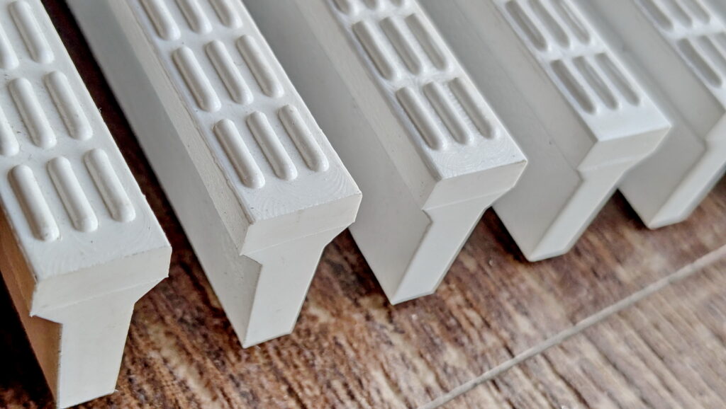 Close-up of solid-filled plastic drainage grating strips showing high structural integrity